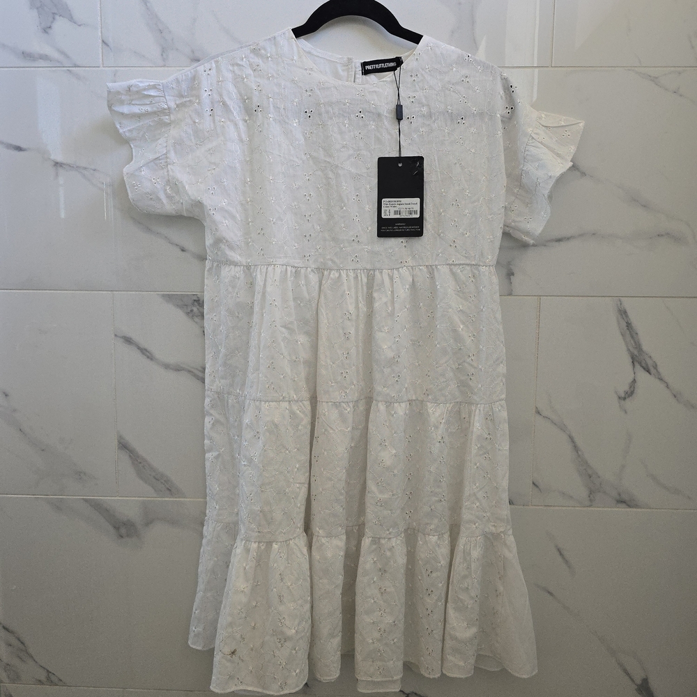 PrettyLittleThing: White Eyelet Baby Doll Dress